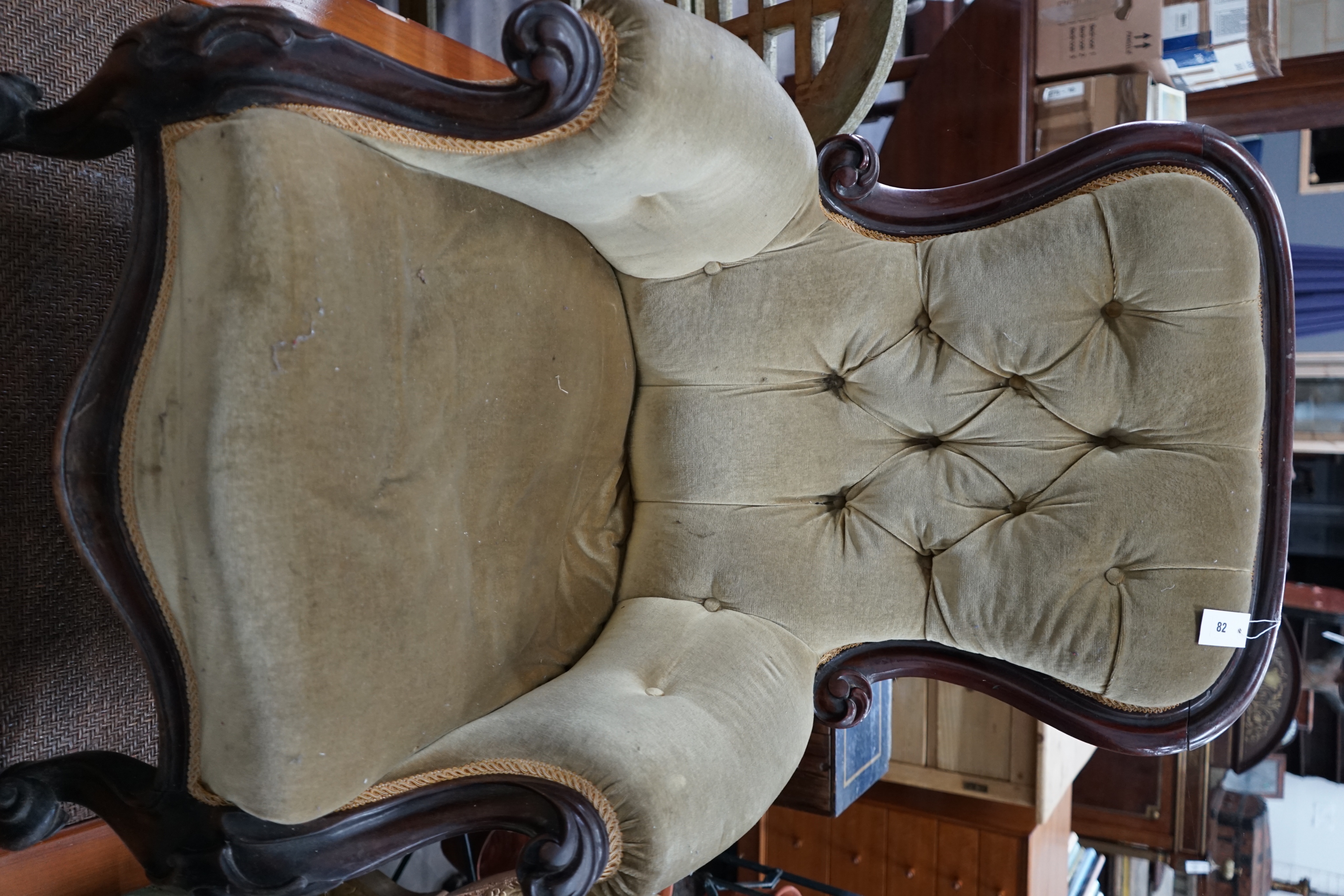 A Victorian mahogany upholstered spoonback armchair, width 70cm depth 70cm height 96cm
